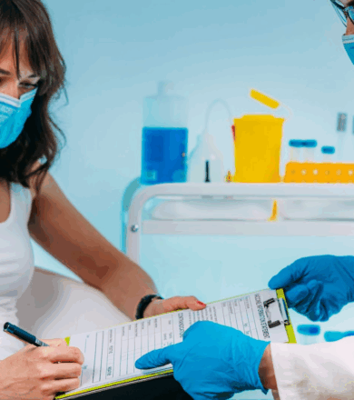 Nursing holding out a form for a patient to sign. 